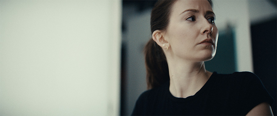 A woman looks to her left